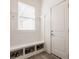 Well-organized mudroom with a built-in bench, cubbies, and hooks for storage and convenience at 15628 Allegro Dr, Westfield, IN 46074