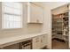 Bright pantry features white cabinets, drawers, and shelves for optimal kitchen storage at 15628 Allegro Dr, Westfield, IN 46074