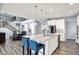 Bright, open-concept kitchen with a large island, white cabinets, and modern appliances at 16516 Wilsons Farm Dr, Fortville, IN 46040