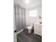 Bathroom with tiled shower, modern sink, and fixtures at 1715 Fletcher Ave, Indianapolis, IN 46203