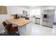 Well-lit kitchen boasting stainless steel appliances, sleek countertops, and ample cabinetry at 1715 Fletcher Ave, Indianapolis, IN 46203