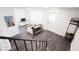 Bright living room featuring hardwood floors, a modern console table, and comfortable seating at 1715 Fletcher Ave, Indianapolis, IN 46203