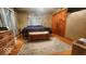 Comfortable bedroom with hardwood floors, wood furniture, and warm colors at 18103 N 300 W, Summitville, IN 46070