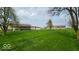 A well-maintained property with mature trees, an outbuilding, and plenty of yard space at 18103 N 300 W, Summitville, IN 46070