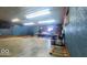 A spacious garage with concrete floors can be used as a workshop or storage space at 18103 N 300 W, Summitville, IN 46070