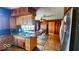 A cozy eat-in kitchen with wood paneling, stainless steel appliances, and lots of windows at 18103 N 300 W, Summitville, IN 46070