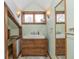 Bathroom features custom vanity, wall sconces, and a framed mirror at 241 S Walnut St, Jamestown, IN 46147