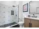 Modern bathroom with sleek glass shower door, black hardware and geometric tiled walls at 244 N Summit St, Indianapolis, IN 46201