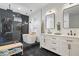 Luxurious primary bath with dual vanities, black marble floors, and a standalone tub at 244 N Summit St, Indianapolis, IN 46201