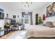 Bright bedroom featuring a workstation, sleek decor, and a comfortable bed at 244 N Summit St, Indianapolis, IN 46201