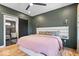 Stylish bedroom with a dark accent wall and an ensuite bathroom at 244 N Summit St, Indianapolis, IN 46201