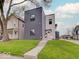 Contemporary home with mixed siding, showcasing a well-manicured lawn and inviting front entrance at 244 N Summit St, Indianapolis, IN 46201