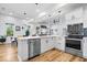 Open concept kitchen with stainless steel appliances and hardwood floors at 244 N Summit St, Indianapolis, IN 46201