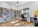 Bright home office with built-in shelving and a large window providing natural light at 244 N Summit St, Indianapolis, IN 46201