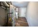 A basement with the hot water heater and furnace with a door leading outside at 2639 Central Ave, Anderson, IN 46016