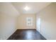 A bedroom with hardwood floors, a window, and a light color paint at 2639 Central Ave, Anderson, IN 46016