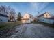 Exterior shot of back of home, featuring a gravel area at 2639 Central Ave, Anderson, IN 46016