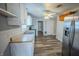Functional kitchen featuring ample counter space, stainless steel appliances, and wood-look floors at 2639 Central Ave, Anderson, IN 46016
