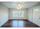 Bright living room featuring hardwood floors and large windows for ample natural light at 2639 Central Ave, Anderson, IN 46016