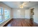 Inviting living room featuring beautiful hardwood floors and a ceiling fan at 2639 Central Ave, Anderson, IN 46016