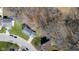 An aerial shot showcases homes with well-maintained lawns and tree-lined streets in a suburban neighborhood at 2895 Prairie Stream Way, Columbus, IN 47203