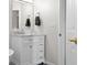 Bright bathroom featuring a mirror and a marble-topped vanity at 2895 Prairie Stream Way, Columbus, IN 47203