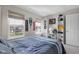 Comfortable bedroom with natural light, shelving, and sport decor at 2895 Prairie Stream Way, Columbus, IN 47203