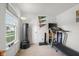 Well-lit workout area with treadmill and punching bag at 2895 Prairie Stream Way, Columbus, IN 47203