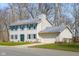 Charming two-story home with light siding, green shutters, well-manicured lawn, and an attached two-car garage at 2895 Prairie Stream Way, Columbus, IN 47203