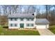 Charming two-story home with light siding, green shutters, well-manicured lawn, and an attached two-car garage at 2895 Prairie Stream Way, Columbus, IN 47203