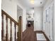 Inviting foyer featuring hardwood floors and a grand staircase at 2895 Prairie Stream Way, Columbus, IN 47203