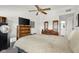 Spacious main bedroom with wooden dresser, ceiling fan, and decor at 2895 Prairie Stream Way, Columbus, IN 47203