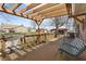 Cozy wooden deck featuring a swing, pergola, grill and outdoor space for relaxation and entertaining at 298 Northridge Dr, Mooresville, IN 46158