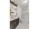 Bathroom with white and black color scheme features a shower and vanity at 298 Northridge Dr, Mooresville, IN 46158