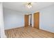 Spacious bedroom featuring wood look floors, light blue walls, and wood door at 298 Northridge Dr, Mooresville, IN 46158