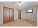 Spacious bedroom offers wood-look flooring, a ceiling fan, and a sliding door closet at 298 Northridge Dr, Mooresville, IN 46158