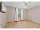 Bright bedroom features a ceiling fan, a window with curtains, and wood-look flooring at 298 Northridge Dr, Mooresville, IN 46158
