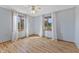 Light filled bedroom features wood look floors, a ceiling fan, and large windows at 298 Northridge Dr, Mooresville, IN 46158