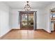Dining area with chandelier and glass doors leading to the backyard at 298 Northridge Dr, Mooresville, IN 46158