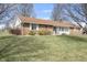 Single story house featuring brick facade, well-manicured lawn and classic architectural details at 298 Northridge Dr, Mooresville, IN 46158