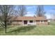 Charming single-story brick home with a well-manicured lawn, front porch and classic architectural details at 298 Northridge Dr, Mooresville, IN 46158