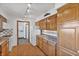 Bright kitchen with wooden cabinets, tile backsplash, and white appliances at 298 Northridge Dr, Mooresville, IN 46158