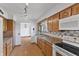 Bright kitchen featuring wooden cabinets, track lighting, and modern appliances at 298 Northridge Dr, Mooresville, IN 46158