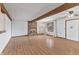 Cozy living room features a brick fireplace, wooden beams, and large windows offering plenty of natural light at 298 Northridge Dr, Mooresville, IN 46158