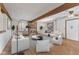 A spacious living room with a fireplace, stylish furnishings, and exposed wood beams adding rustic charm at 298 Northridge Dr, Mooresville, IN 46158