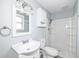 This bathroom features a white sink, white vanity, white shower, and gray walls at 315 S Parkway Dr, Anderson, IN 46013