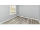 This bedroom features durable gray flooring and a large window providing natural light at 315 S Parkway Dr, Anderson, IN 46013
