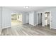 This bedroom features durable gray flooring, sliding glass door, closet, and entry to bathroom at 315 S Parkway Dr, Anderson, IN 46013