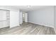 This bedroom features durable gray flooring, sliding closet, and a entry door at 315 S Parkway Dr, Anderson, IN 46013