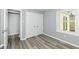 This bedroom features durable gray flooring, closet, and a window providing natural light at 315 S Parkway Dr, Anderson, IN 46013